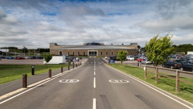 The British Motor Museum building at Gaydon, seen from the entrance road with the car park on either side