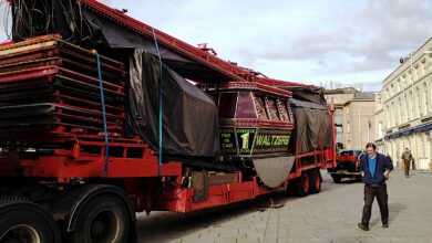 A lorry carrying the waltzers ride into Warwick Market Place for the Mop fair