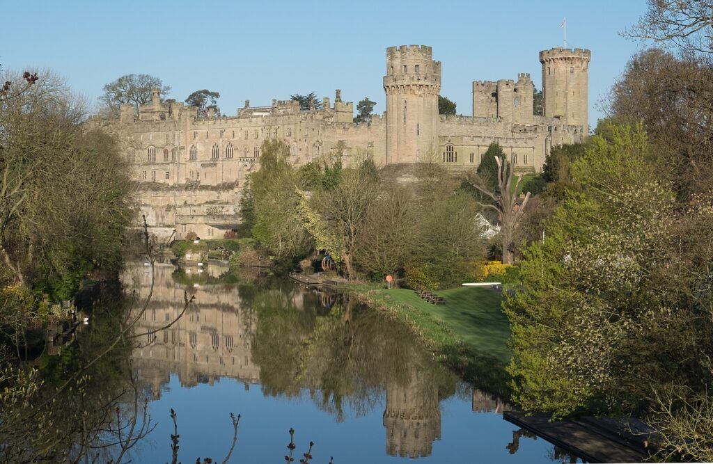 Warwick Castle's walls and towers on a sunny day