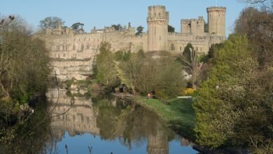 Warwick Castle's walls and towers on a sunny day