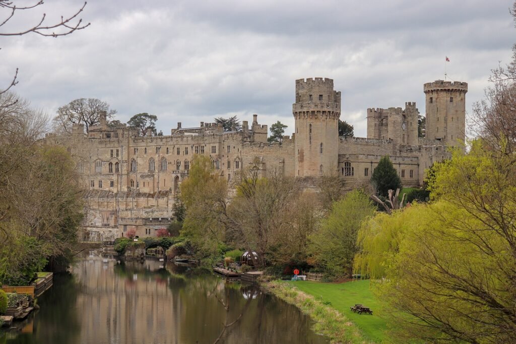 Warwick Castle's towers and walls above the River Avon, seen from Castle Bridge