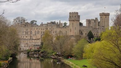 Warwick Castle's towers and walls above the River Avon, seen from Castle Bridge