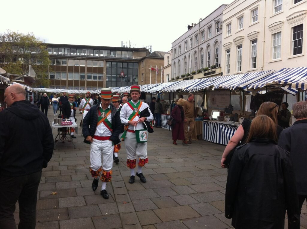 Morris dancers and market stalls in Warwick Market Place