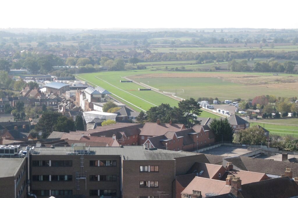 Rooftops of south-west Warwick with the green track of Warwick Racecourse behind them
